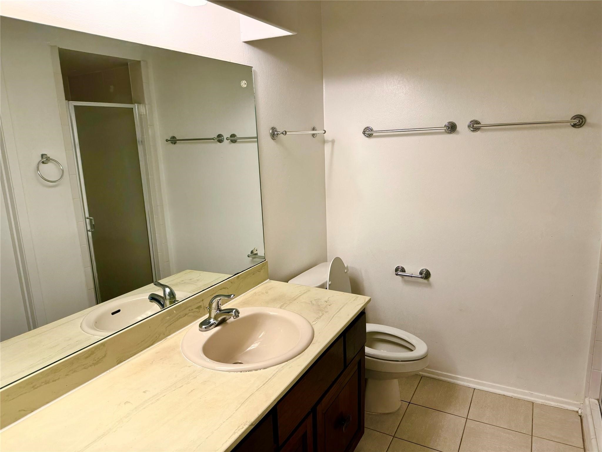 7015 Pyron Way Houston, TX 77036 - Photo 7 of 12 a bathroom with a sink and a toilet