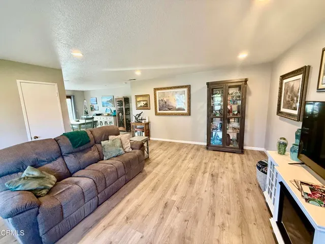 a view of a room with lots of wooden furniture