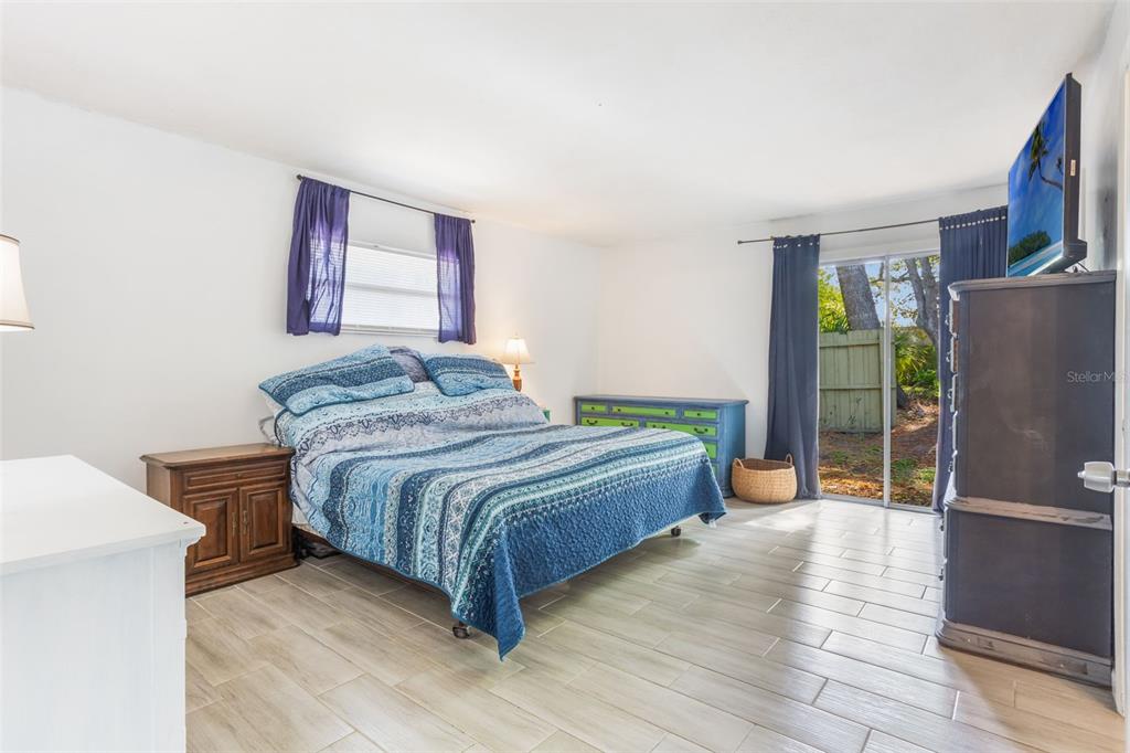 1029 Antelope Trail Winter Springs, FL 32708 - Photo 15 of 28 a bedroom with a bed and a refrigerator