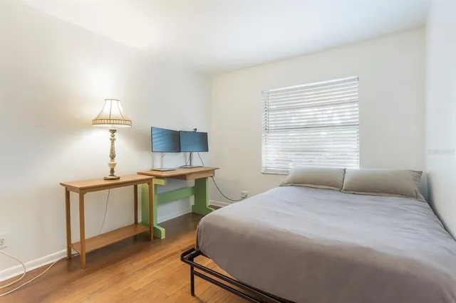 a bedroom with a bed and a chair