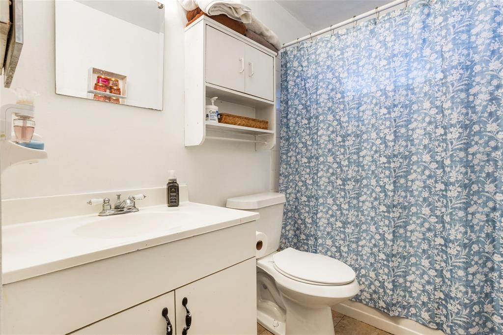 1029 Antelope Trail Winter Springs, FL 32708 - Photo 21 of 28 a bathroom with a sink a toilet and a mirror