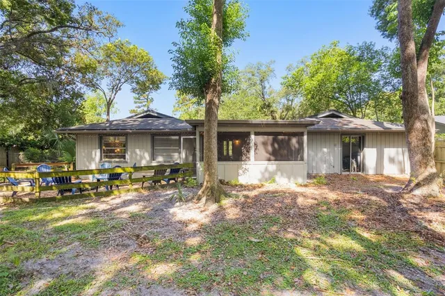 a view of a yard with a tree