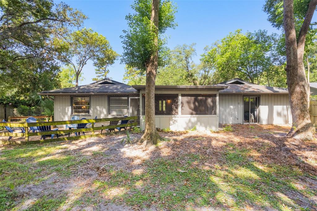1029 Antelope Trail Winter Springs, FL 32708 - Photo 26 of 28 a front view of a house with a garden and trees