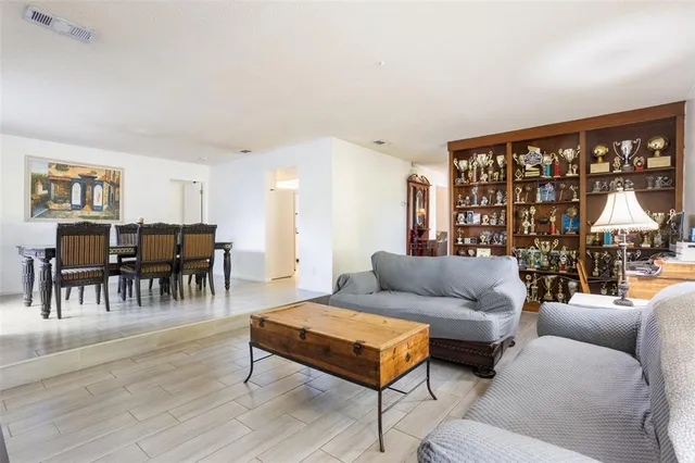 a view of a dining room with furniture and a window