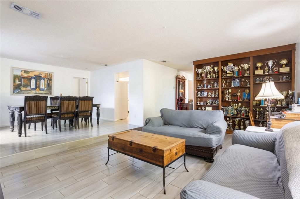 1029 Antelope Trail Winter Springs, FL 32708 - Photo 9 of 28 a living room with furniture and a large window