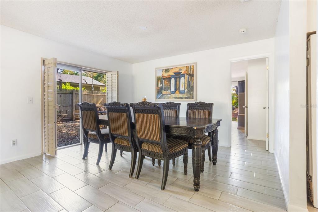 1029 Antelope Trail Winter Springs, FL 32708 - Photo 10 of 28 a view of a dining room with furniture and a window