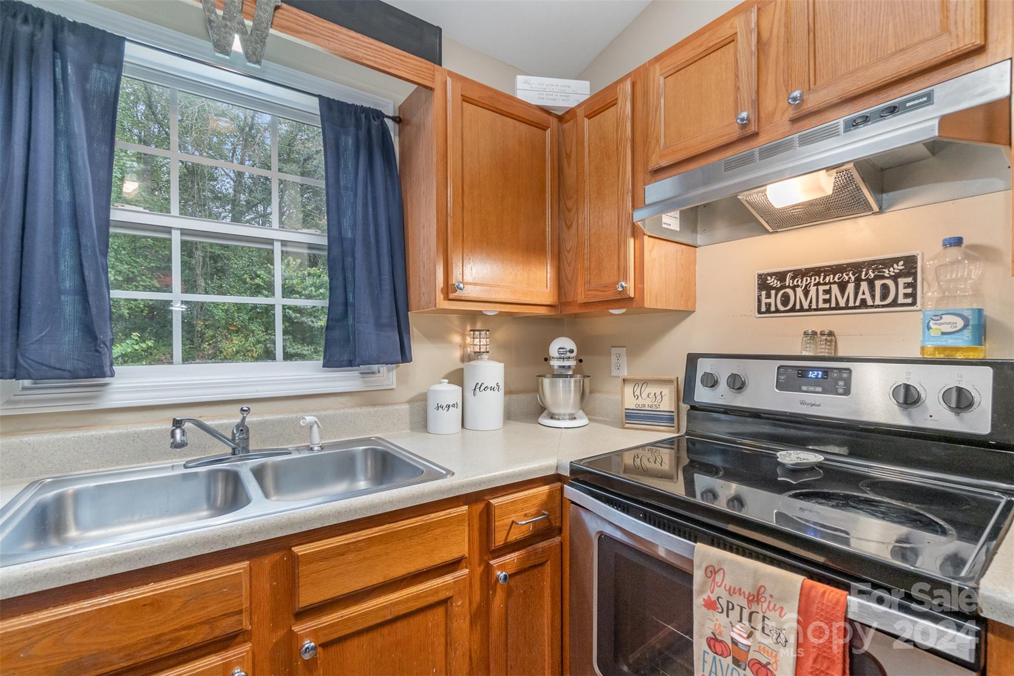 3526 Herman Sipe Road Conover, NC 28613 - Photo 8 of 29 a kitchen with stainless steel appliances granite countertop a sink and a stove