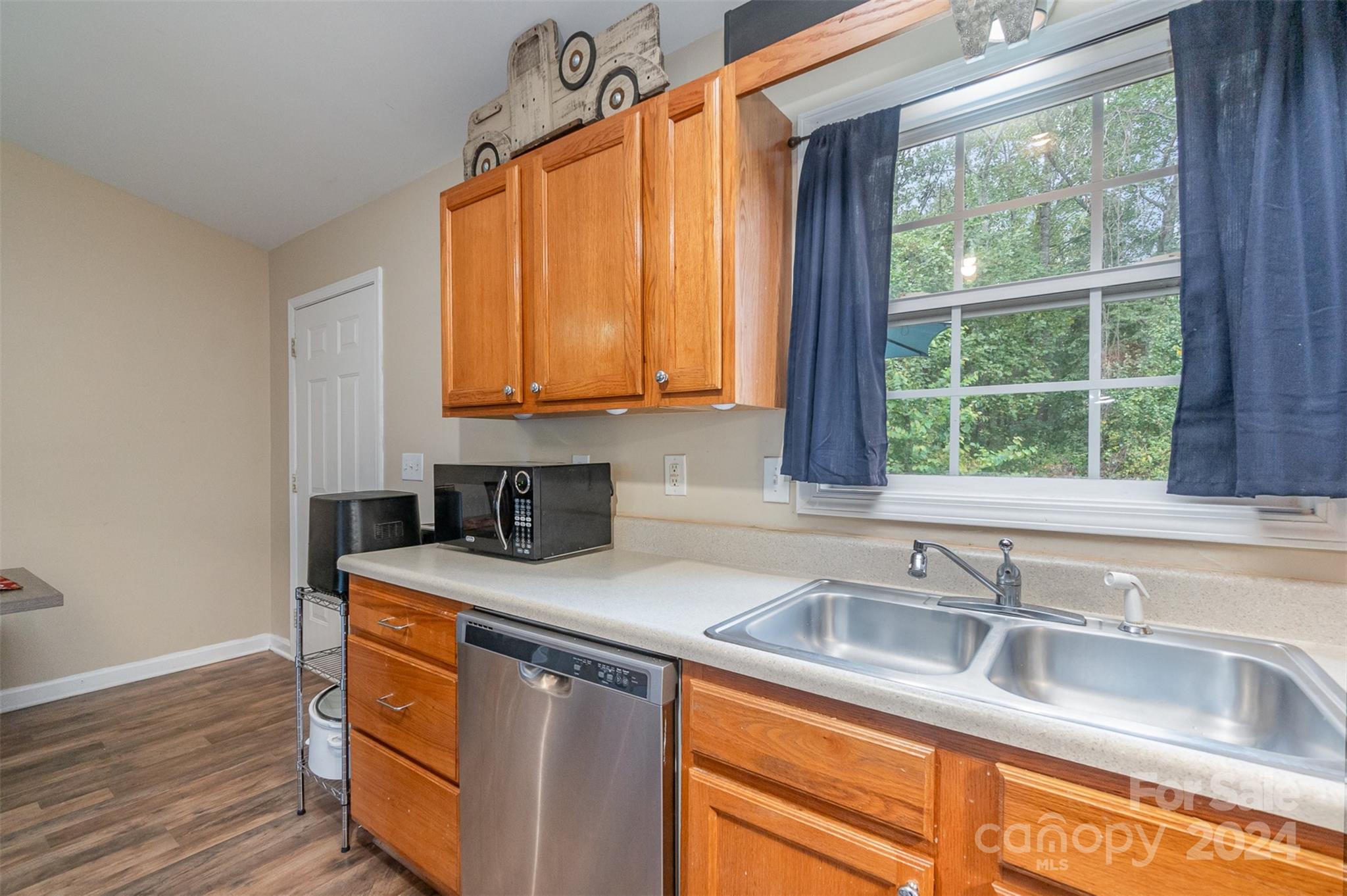 3526 Herman Sipe Road Conover, NC 28613 - Photo 9 of 29 a kitchen with stainless steel appliances granite countertop a sink a window and next to a window