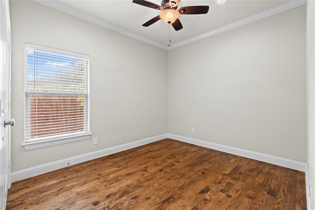 7806 Garner Road Rowlett, TX 75088 - Photo 20 of 34 a view of an empty room with wooden floor and a window