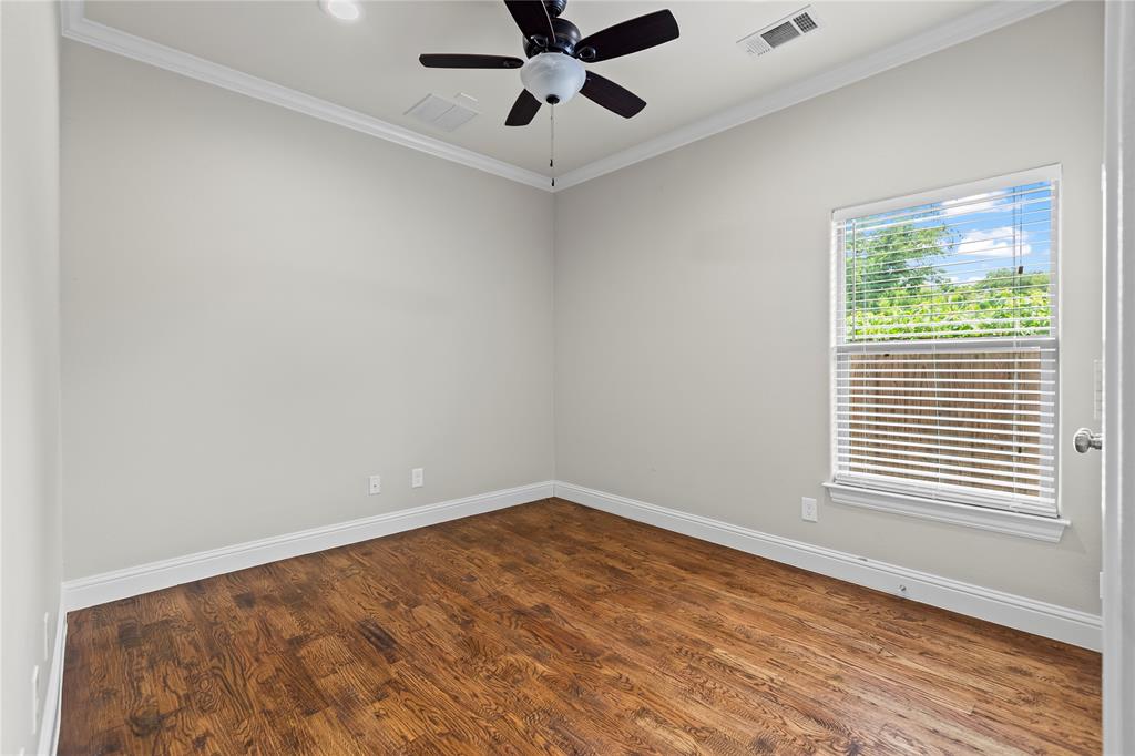 7806 Garner Road Rowlett, TX 75088 - Photo 23 of 34 an empty room with a window and a fan