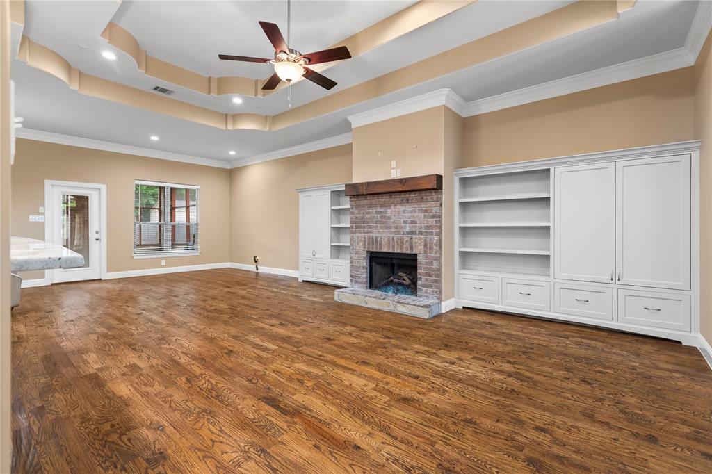 7806 Garner Road Rowlett, TX 75088 - Photo 24 of 34 a view of an empty room with a fireplace and a window