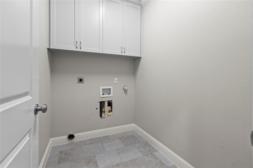 7806 Garner Road Rowlett, TX 75088 - Photo 25 of 34 a view of storage and utility room with empty racks