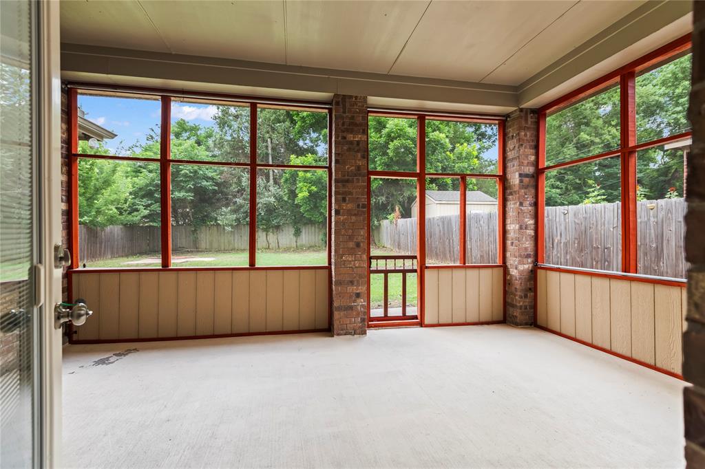 7806 Garner Road Rowlett, TX 75088 - Photo 26 of 34 an empty room with large windows