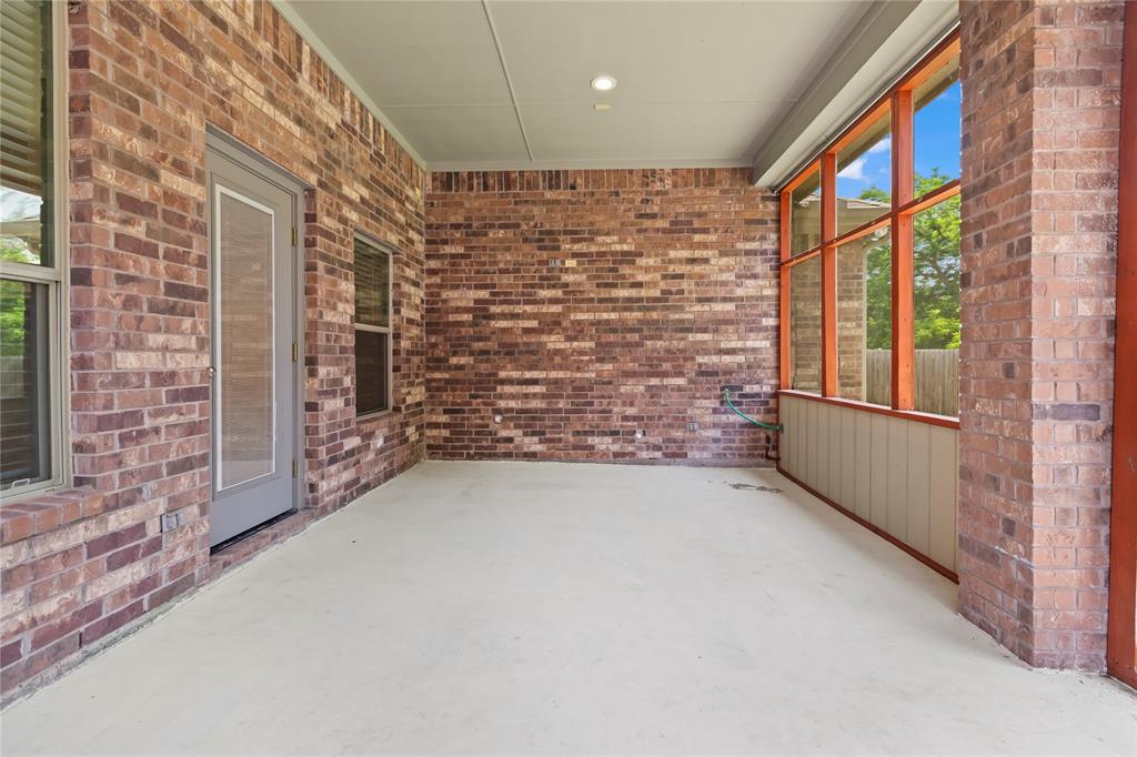 7806 Garner Road Rowlett, TX 75088 - Photo 27 of 34 a view of an empty room with brick walls