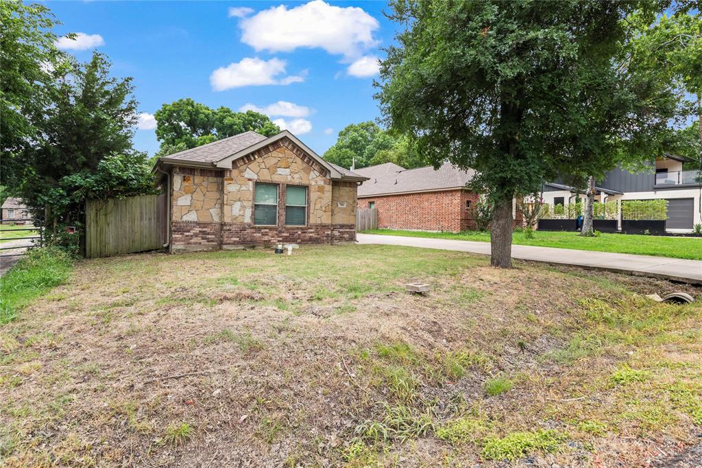 7806 Garner Road Rowlett, TX 75088 - Photo 3 of 34 a view of a house with a yard