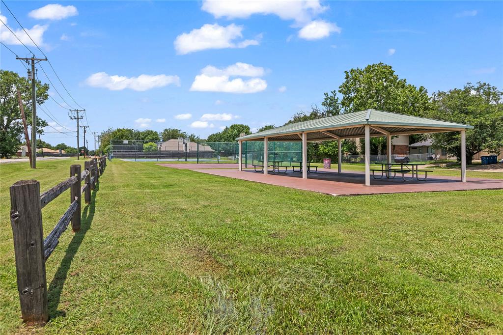 7806 Garner Road Rowlett, TX 75088 - Photo 33 of 34 a view of a house with a backyard porch and sitting area