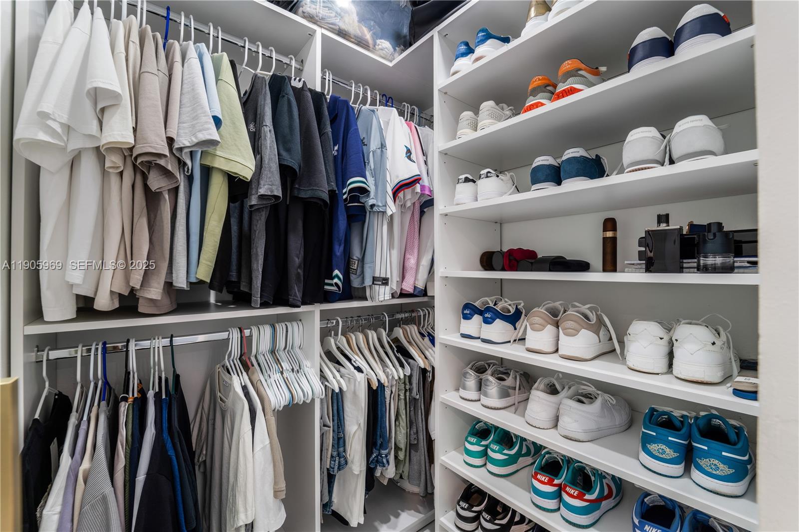 9746 Southwest 147th Court Miami, FL 33196 - Photo 19 of 42 a view of walk in closet with clothes and shoes