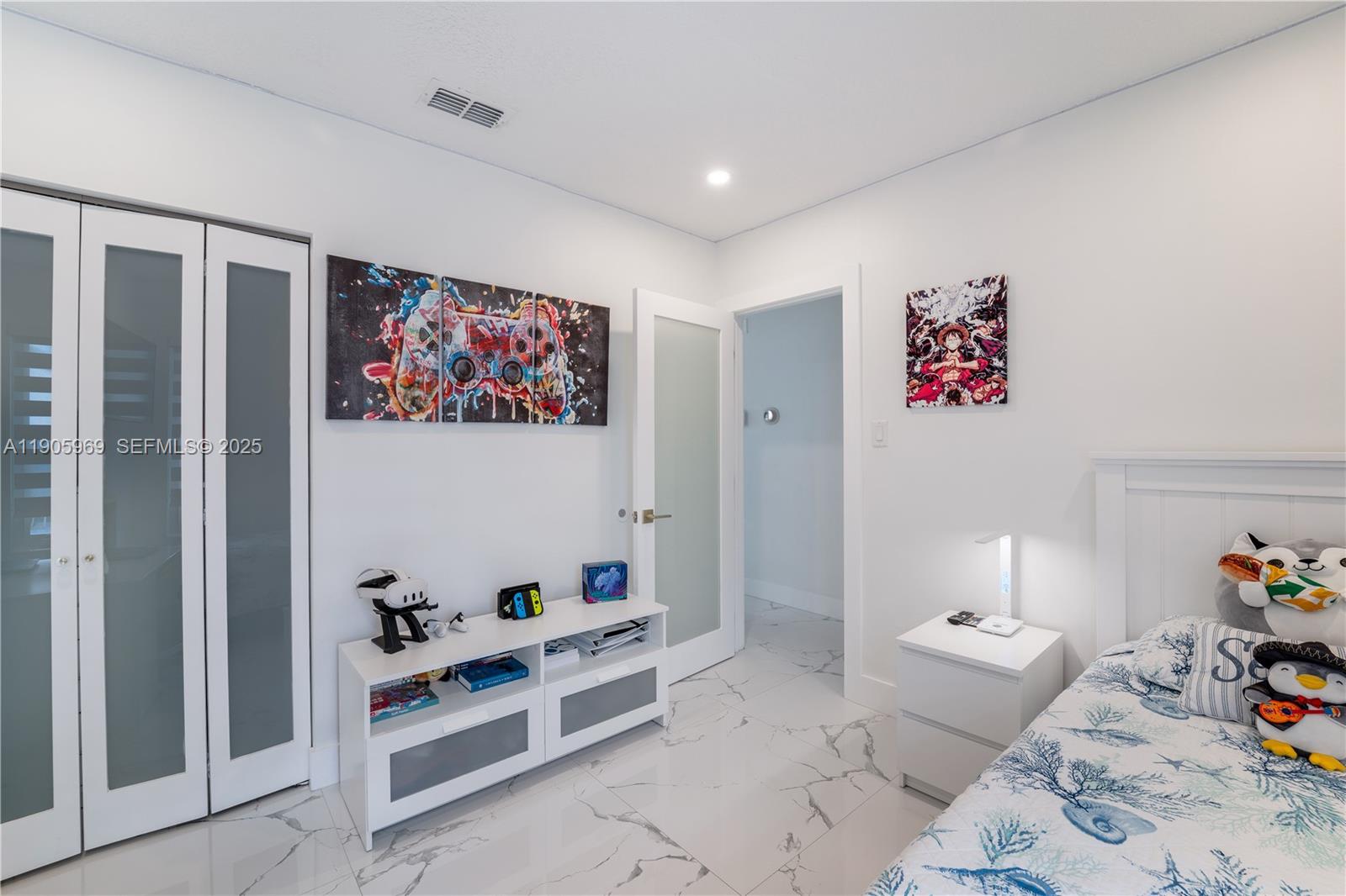 9746 Southwest 147th Court Miami, FL 33196 - Photo 22 of 42 a bedroom with furniture and a bed