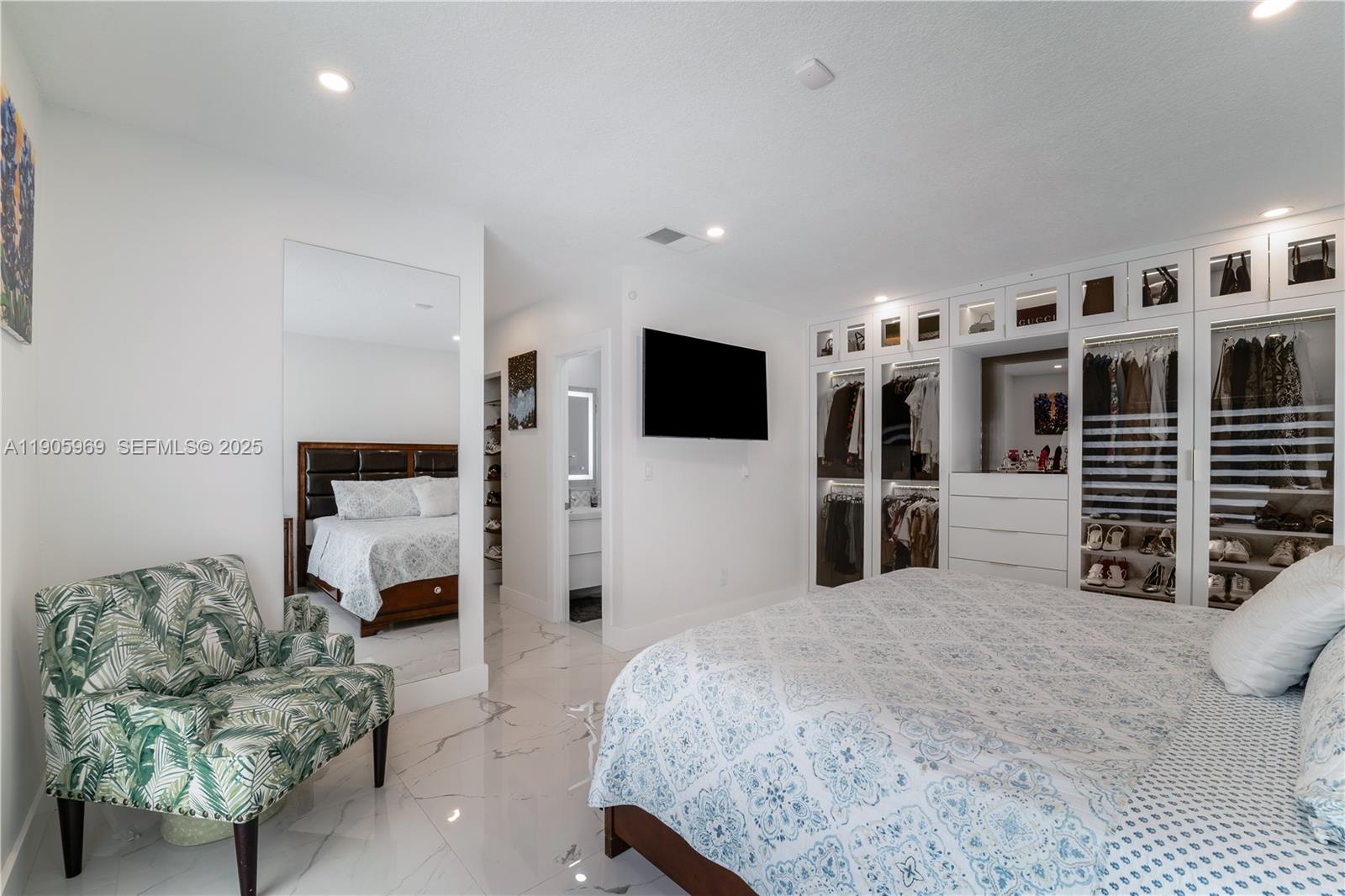 9746 Southwest 147th Court Miami, FL 33196 - Photo 25 of 42 a bedroom with furniture and a flat screen tv