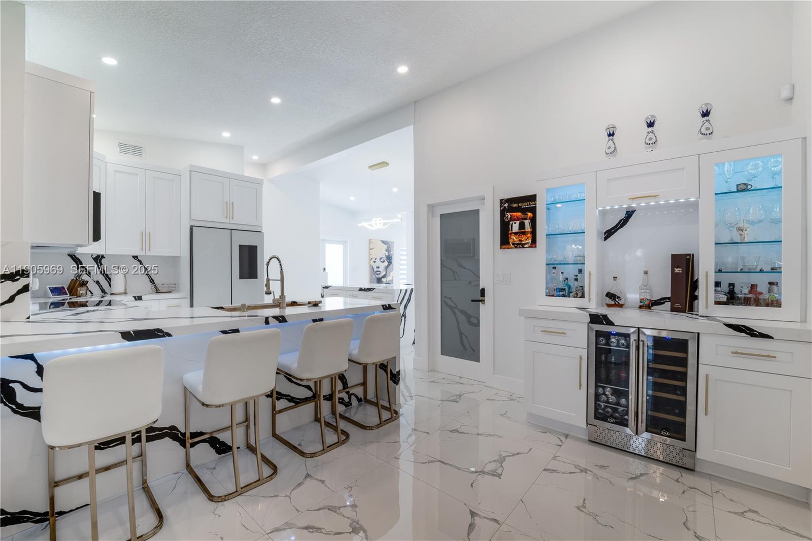 9746 Southwest 147th Court Miami, FL 33196 - Photo 9 of 42 a kitchen with stainless steel appliances kitchen island granite countertop a sink and cabinets