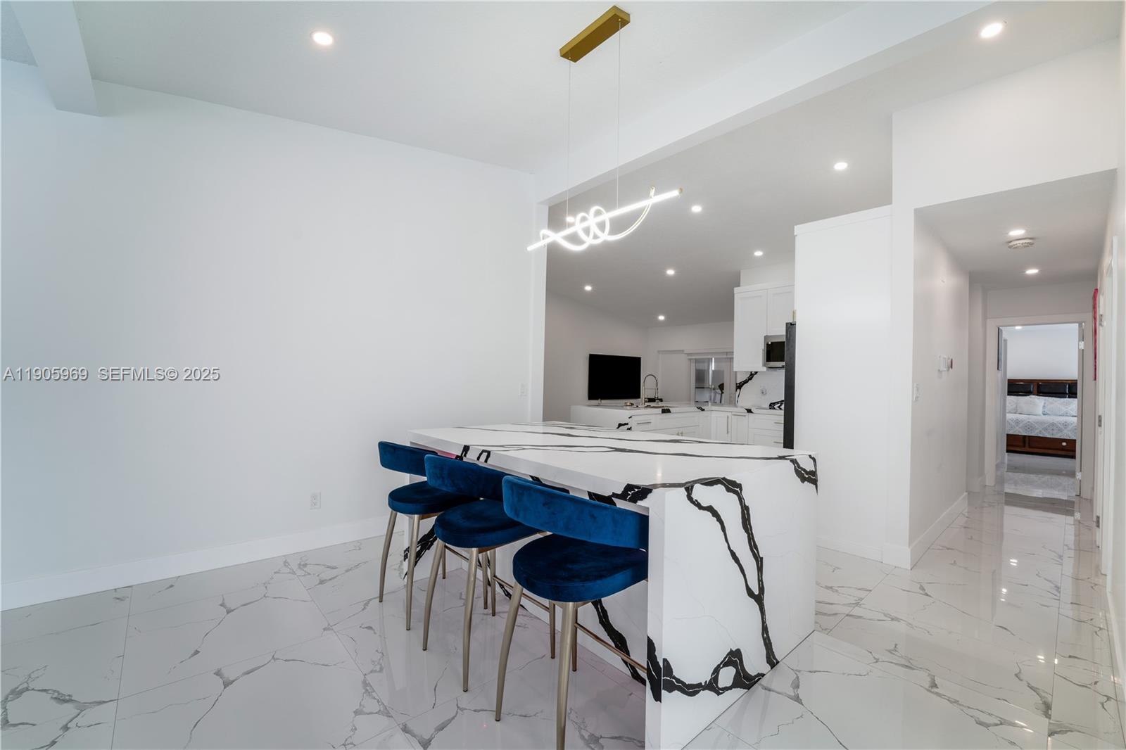9746 Southwest 147th Court Miami, FL 33196 - Photo 10 of 42 a kitchen with a table and chairs in it