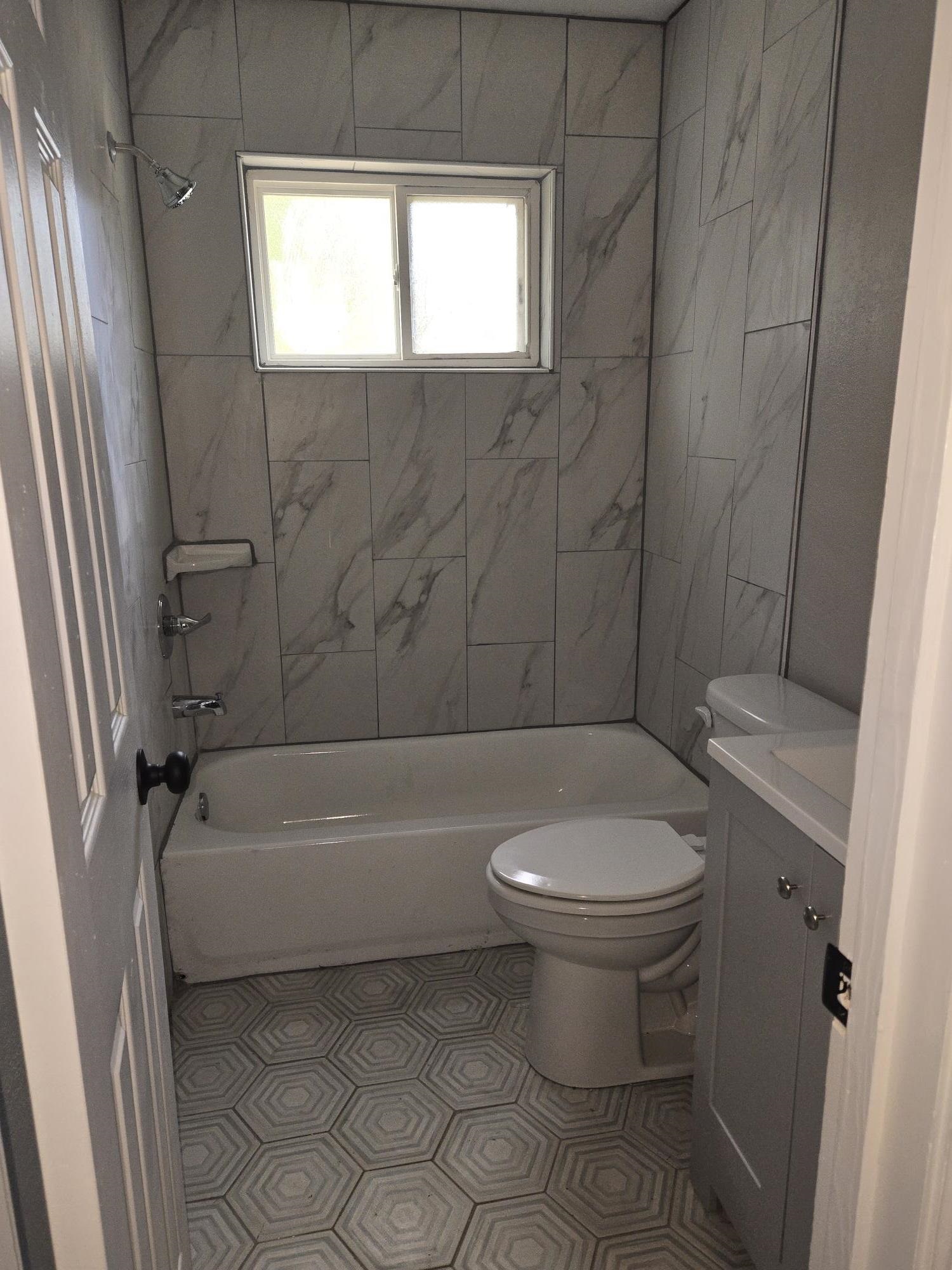 2270 Celeste Drive Memphis, TN 38127 - Photo 8 of 11 Bathroom featuring toilet, shower / bathing tub combination, and vanity