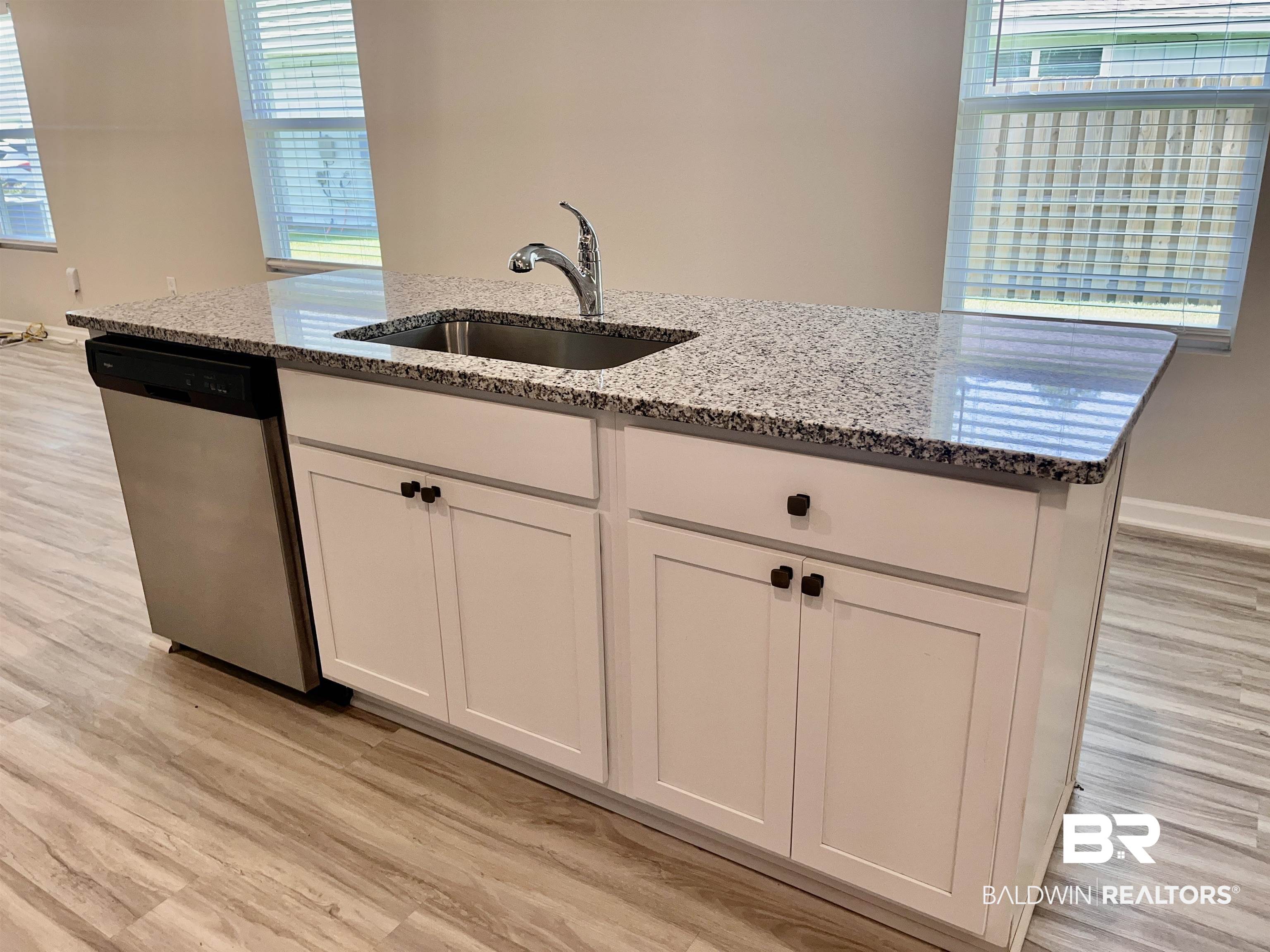 8891 Summer Bay Lane Foley, AL 36535 - Photo 19 of 54 Water filter at kitchen sink.