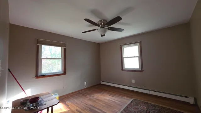 a view of an empty room with a window