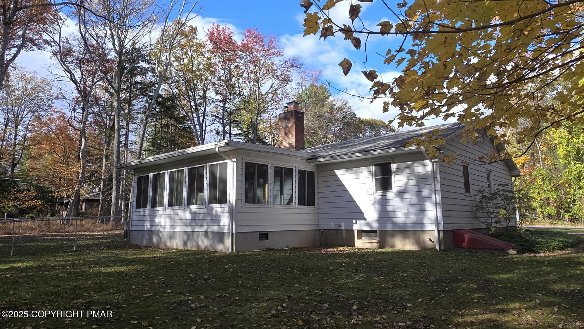 781 White Oak Road Cresco, PA 18326 - Photo 2 of 37 a front view of a house with a garden