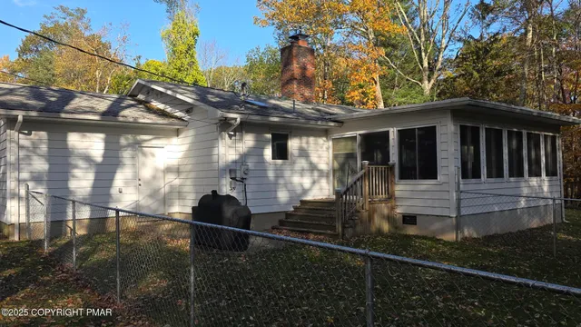 a view of a back yard of the house