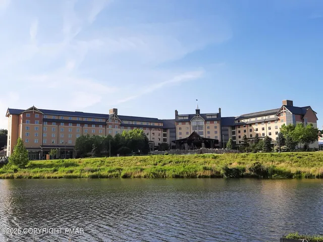 a view of a ocean with a large building in the background