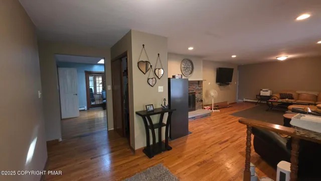 a view of a patio with furniture and wooden floor