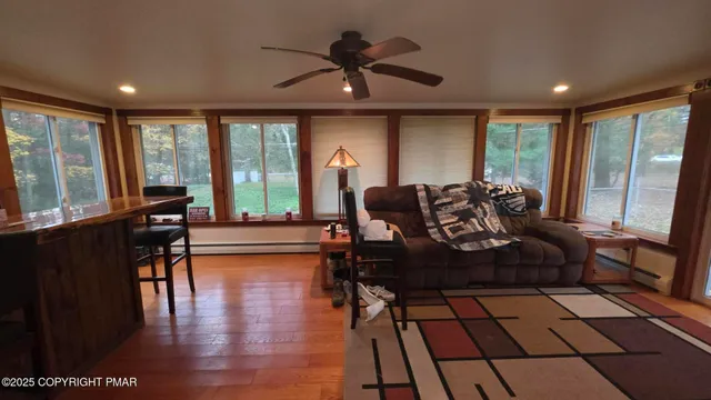 a living room with furniture and a large window