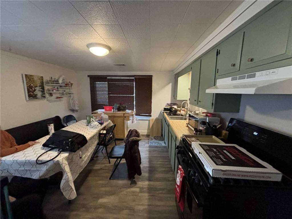 244 Spring Run Road Crescent, PA 15046 - Photo 15 of 17 a kitchen with stainless steel appliances kitchen island granite countertop a stove and a sink