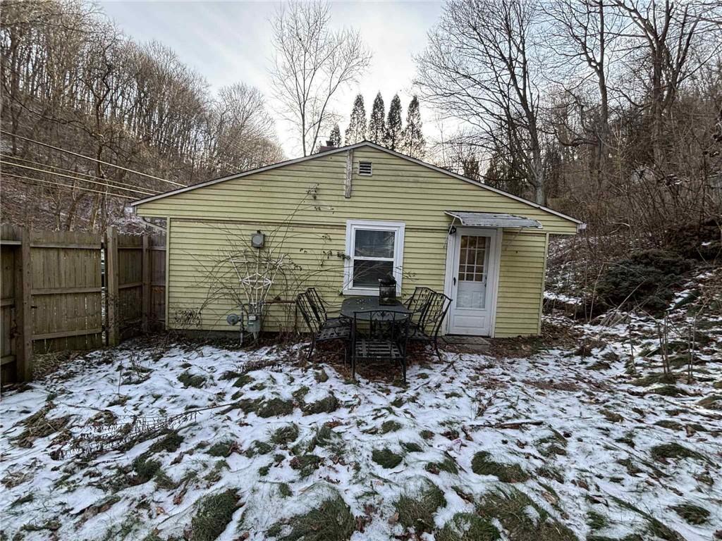 244 Spring Run Road Crescent, PA 15046 - Photo 4 of 17 a backyard of a house with large trees and wooden fence