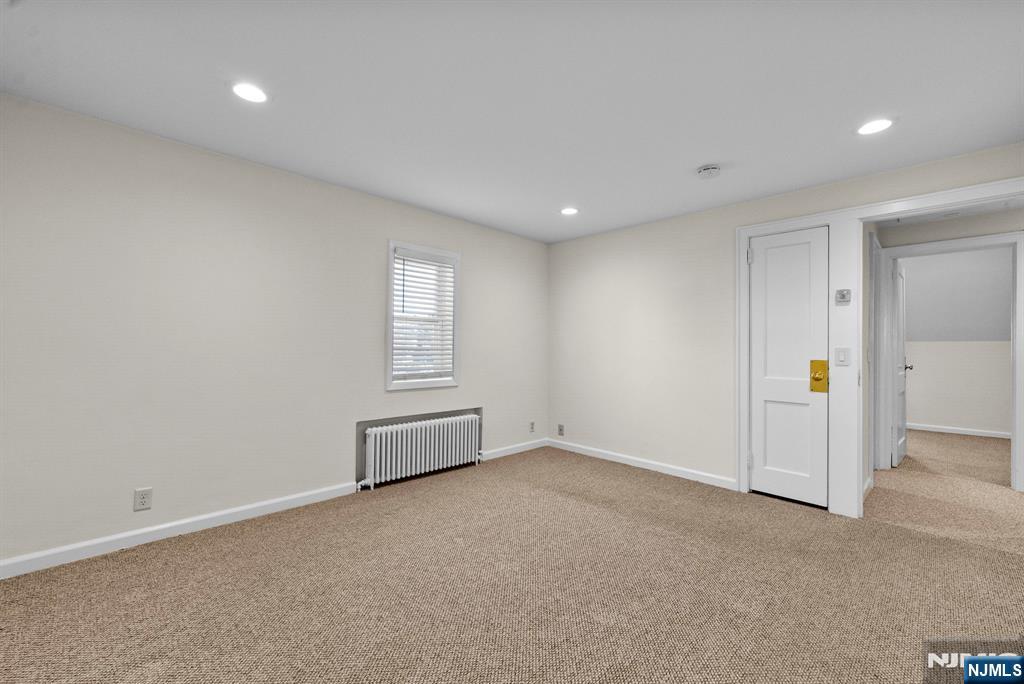 461 9th Street, Unit 2 Fairview, NJ 07022 - Photo 17 of 19 an empty room with entrance and windows