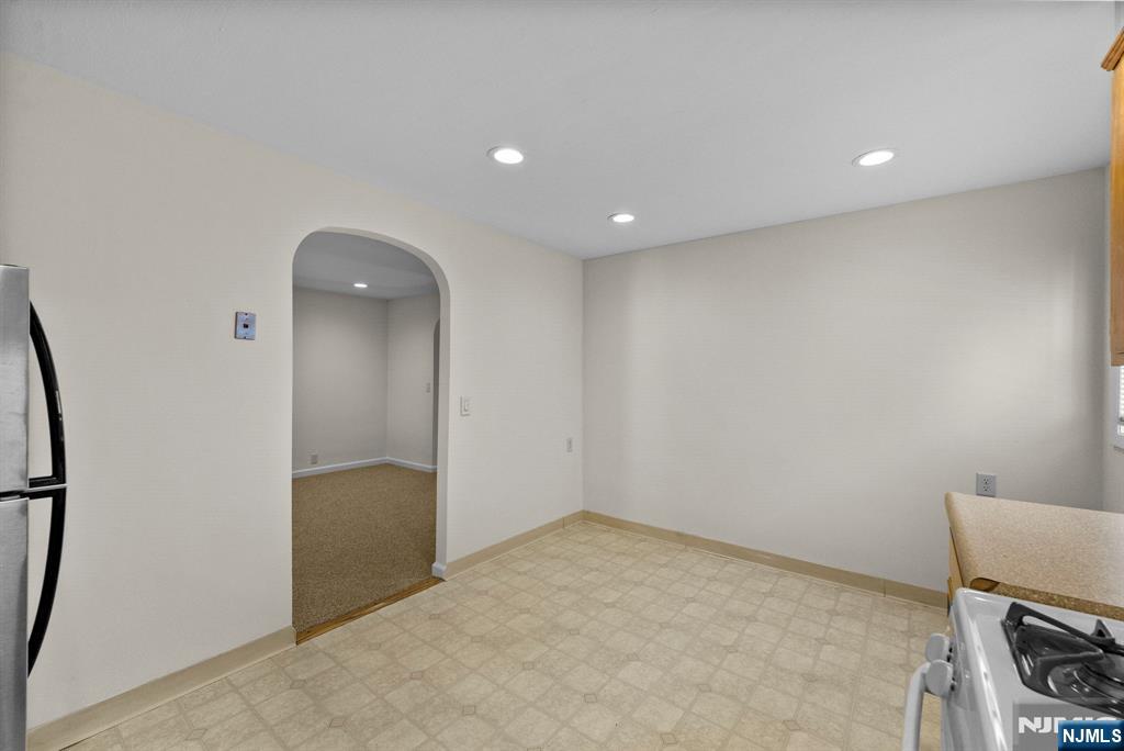 461 9th Street, Unit 2 Fairview, NJ 07022 - Photo 8 of 19 an empty room with a bench