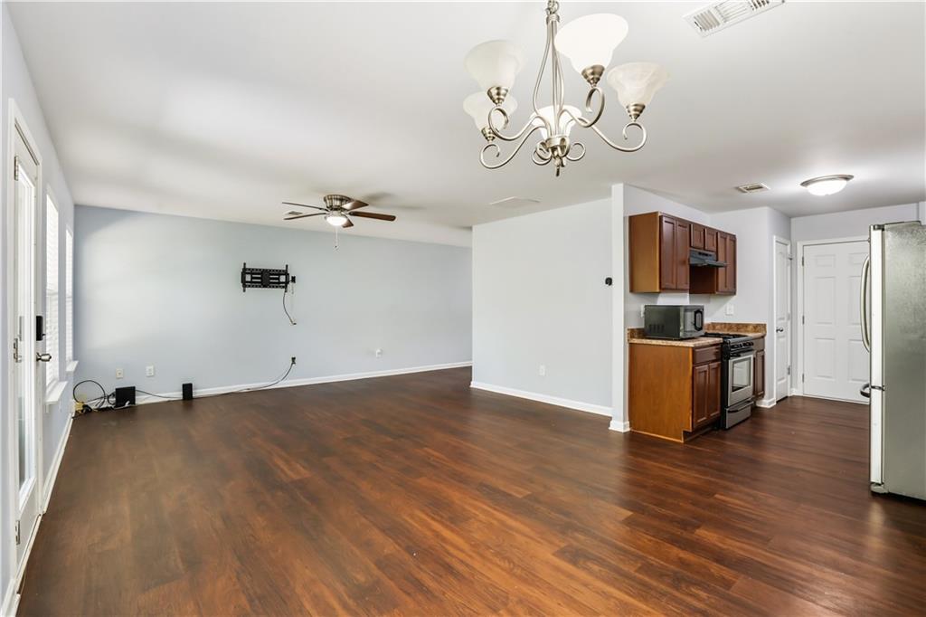1221 Rockfield Circle Norcross, GA 30093 - Photo 6 of 10 a view of a kitchen with a sink and a stove