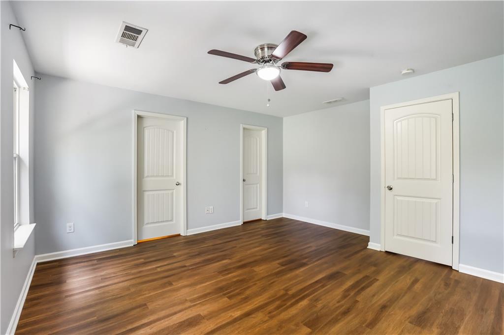 1221 Rockfield Circle Norcross, GA 30093 - Photo 10 of 10 a view of an empty room with wooden floor