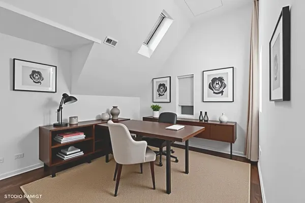 a view of a workspace with furniture