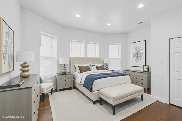 a spacious bedroom with a bed and window