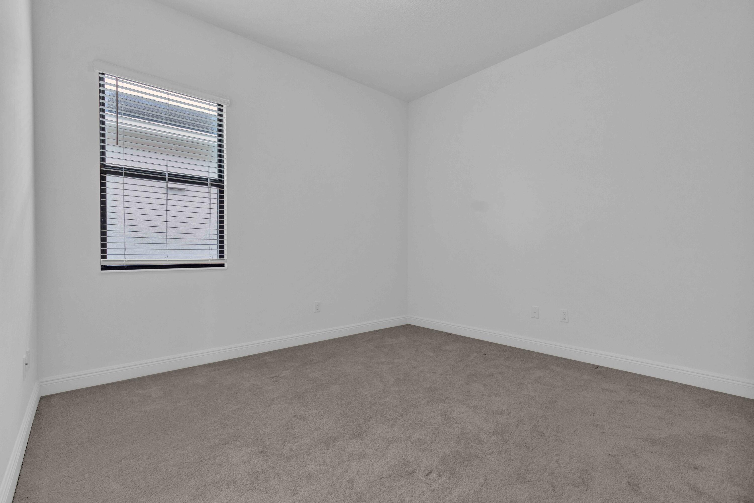 5501 Santa Rosa Lane Westlake, FL 33470 - Photo 15 of 31 an empty room with a window