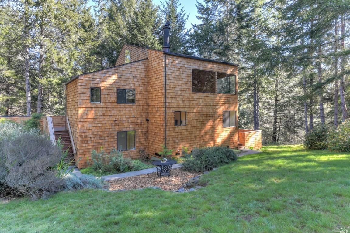900 River Beach Road The Sea Ranch, CA 95497 - Photo 1 of 1 a backyard of a house with lots of green space
