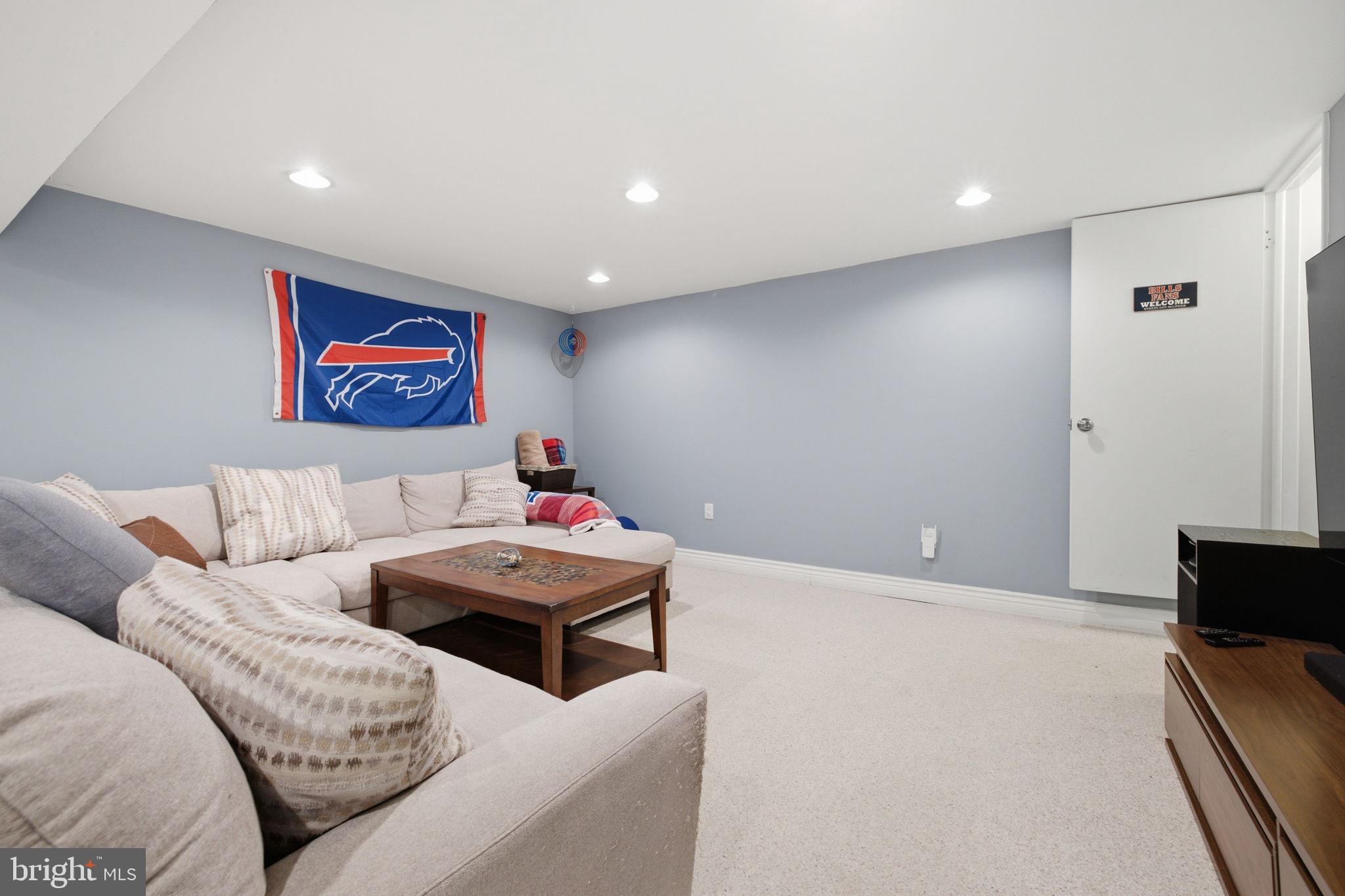 11937 Bayswater Road Gaithersburg, MD 20878 - Photo 33 of 55 Cozy basement retreat with team spirit.