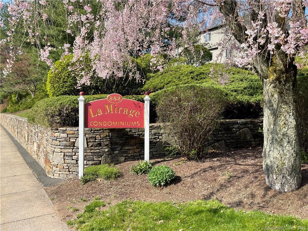 a sign board with yard in the back
