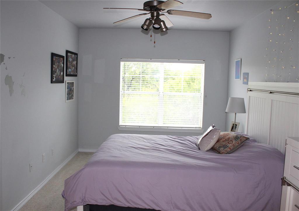 3102 Kings Road, Unit 1207 Dallas, TX 75219 - Photo 12 of 22 a bedroom with a bed and a window