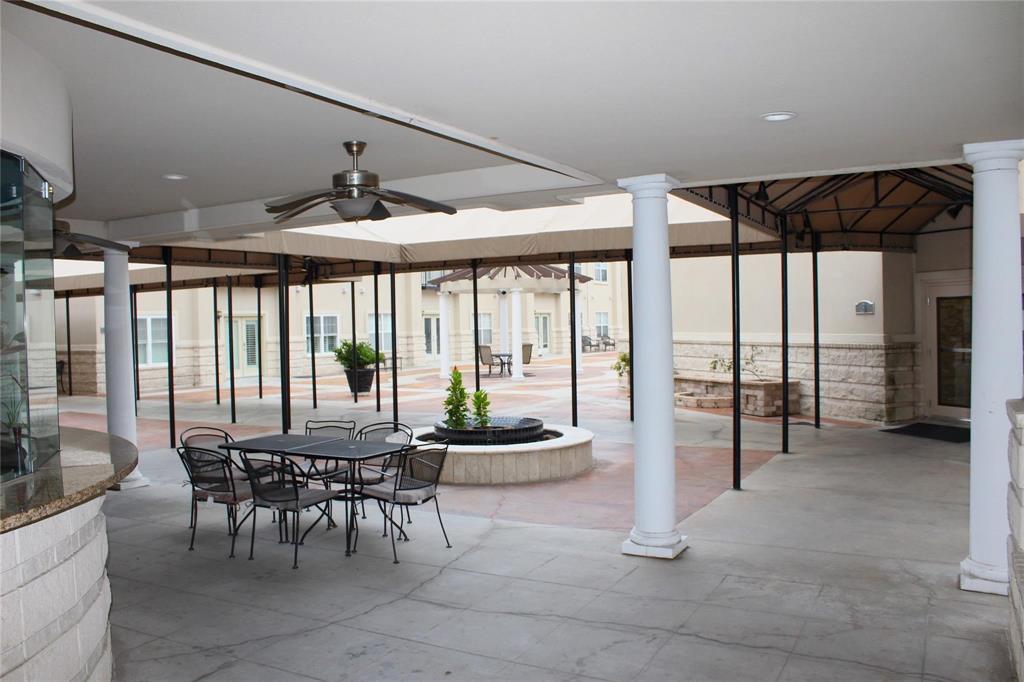 3102 Kings Road, Unit 1207 Dallas, TX 75219 - Photo 19 of 22 a room with lots of furniture and a large window