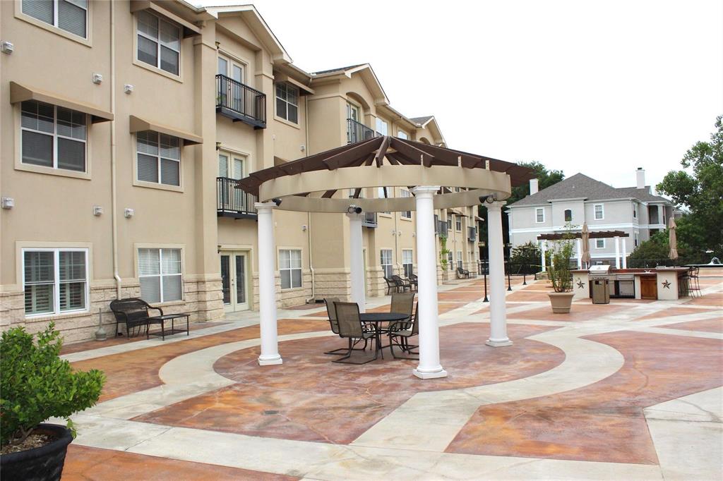 3102 Kings Road, Unit 1207 Dallas, TX 75219 - Photo 20 of 22 a view of a building with a patio