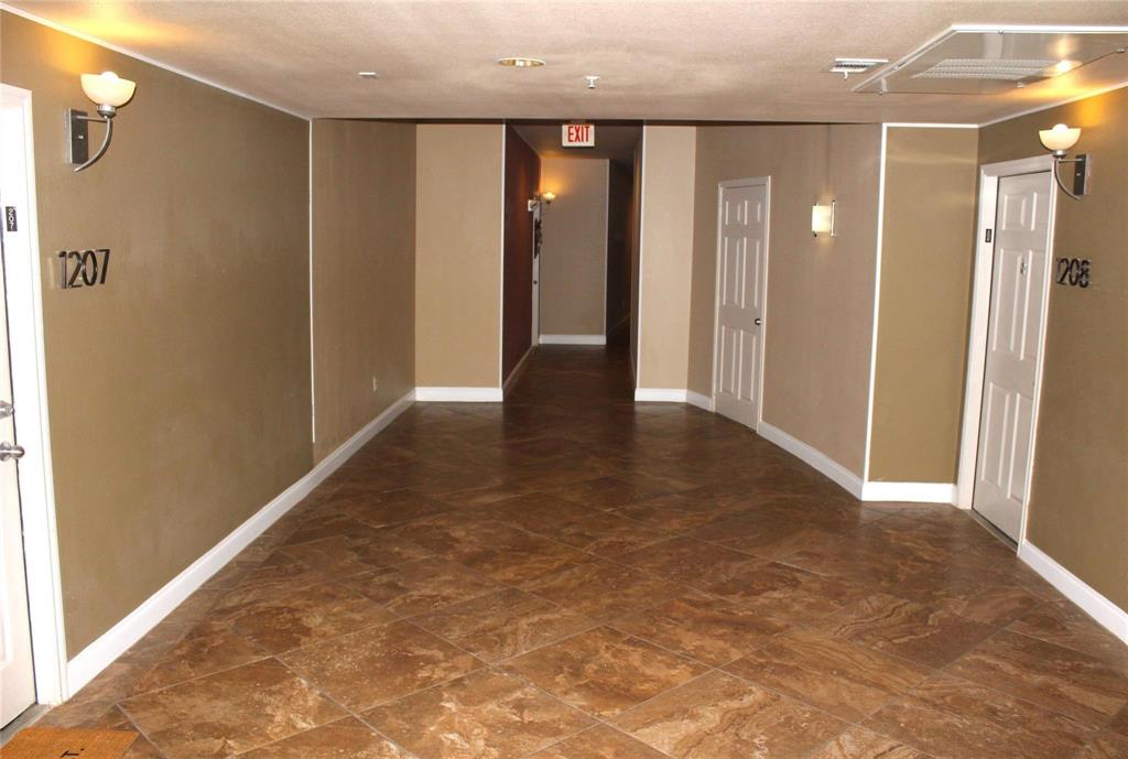 3102 Kings Road, Unit 1207 Dallas, TX 75219 - Photo 4 of 22 a view of entryway with wooden floor