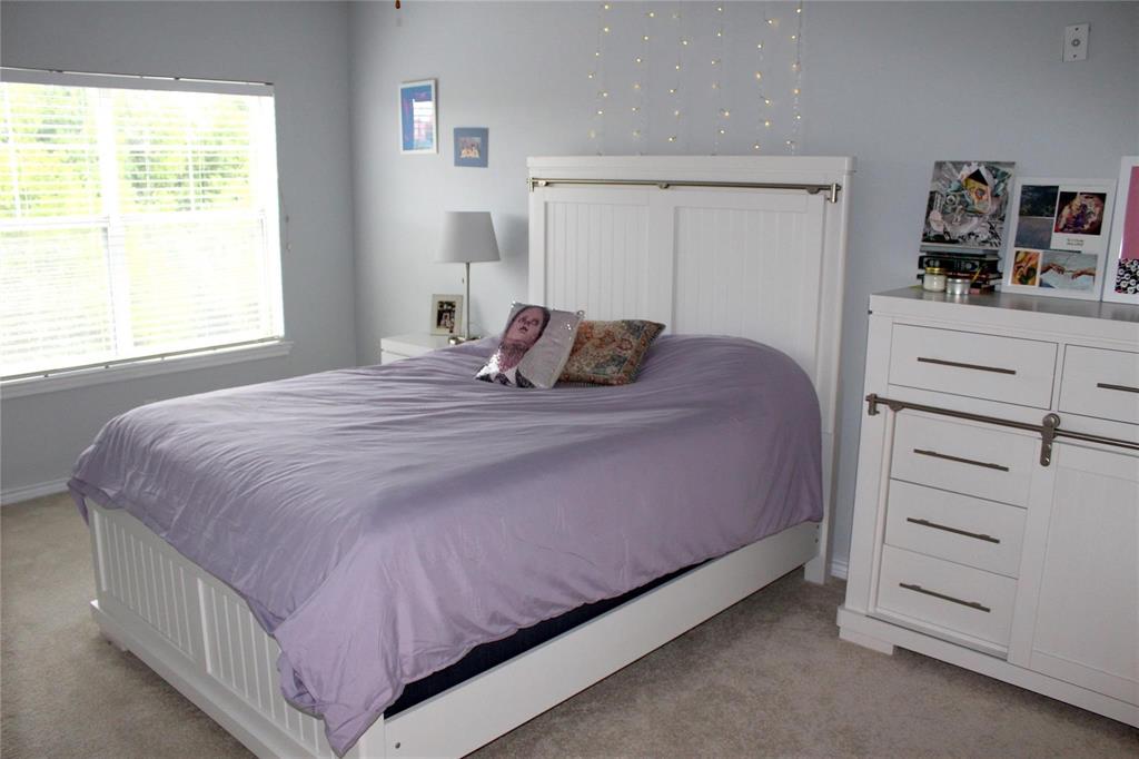 3102 Kings Road, Unit 1207 Dallas, TX 75219 - Photo 10 of 22 a bedroom with a bed and a window